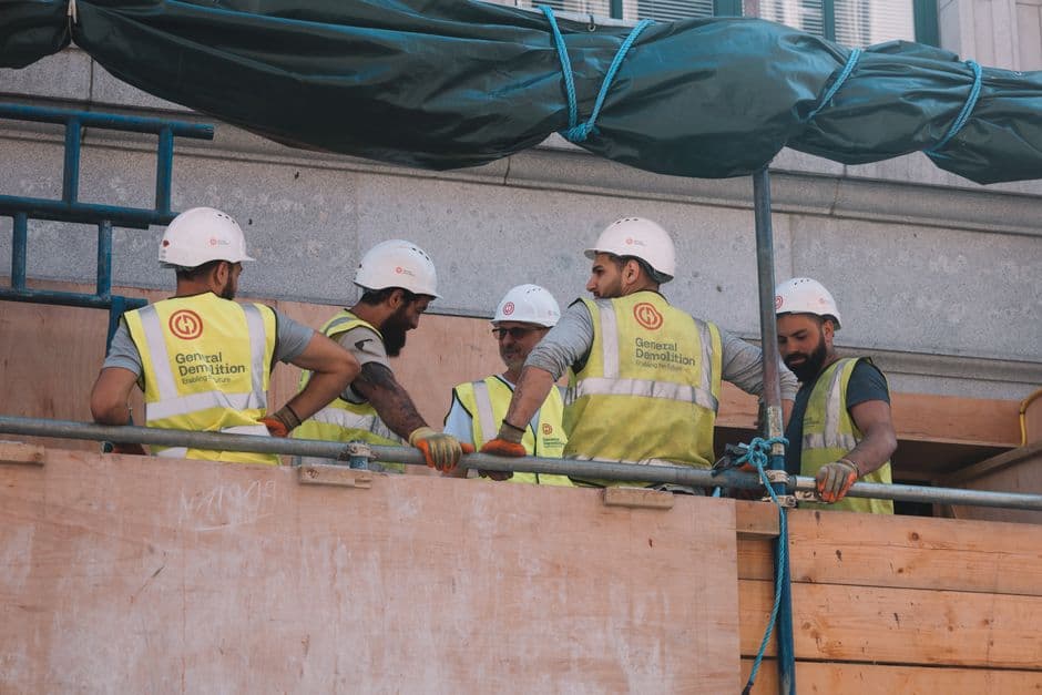 Construction back office reviewing coded invoices