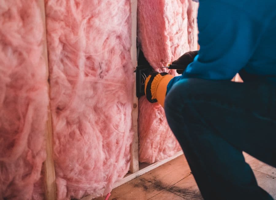 Insulation work on an active construction site